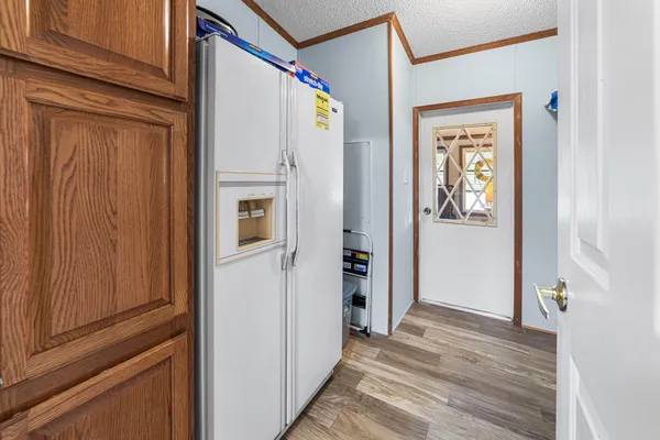 a bedroom with a bed couch and window