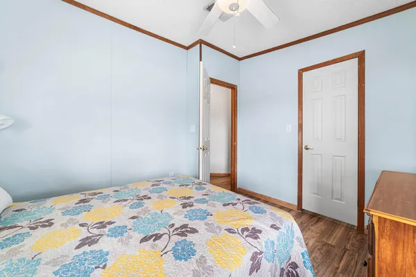 an aerial view of a house with a garden and lake view