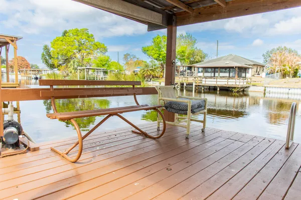 a view of swimming pool with outdoor seating and yard