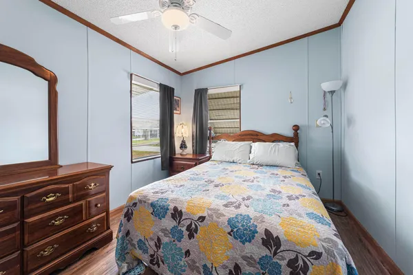 a room with patio furniture and a fireplace