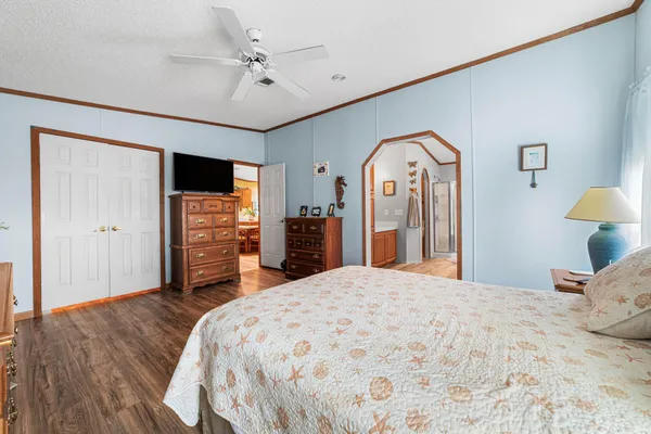 a roof deck with table and chairs a barbeque with wooden floor and plants