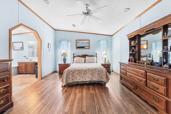 a view of a balcony with wooden floor and fence