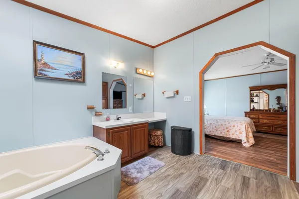 a view of a house with a yard and potted plants