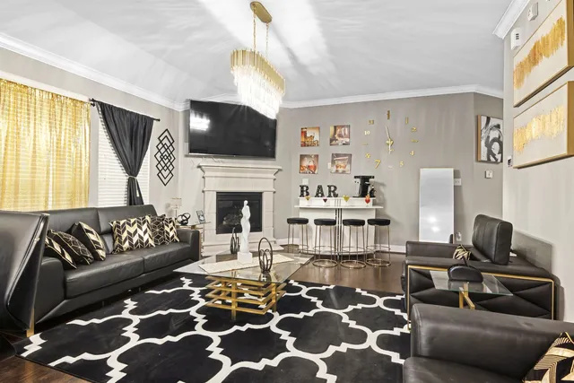 a living room with furniture fireplace and flat screen tv