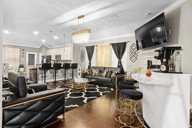 a room with gym equipment and a flat screen tv