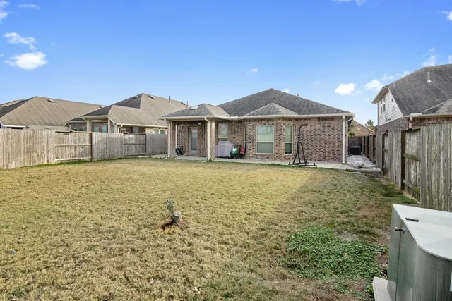 a view of a house with a garden and yard