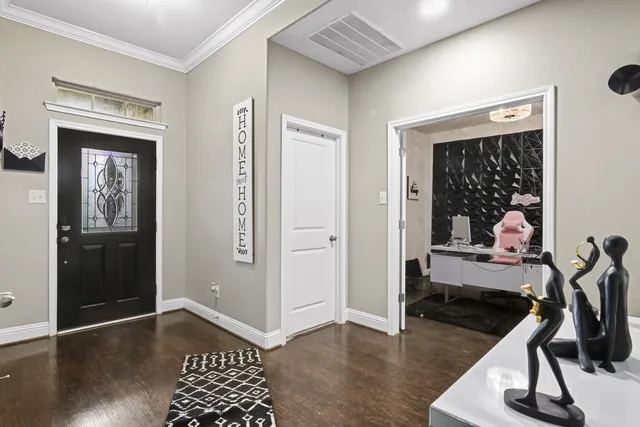a view of a hallway with wooden floor and bedroom