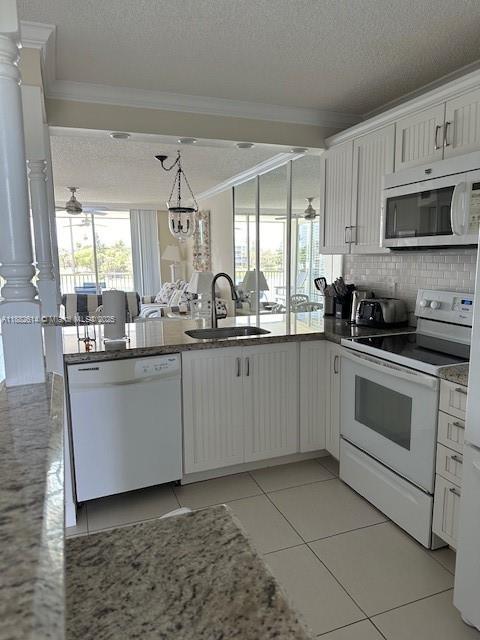 353 Highway 1, Unit C307 Jupiter, FL 33477 - Photo 3 of 12 a kitchen with stainless steel appliances granite countertop a sink a stove and cabinets