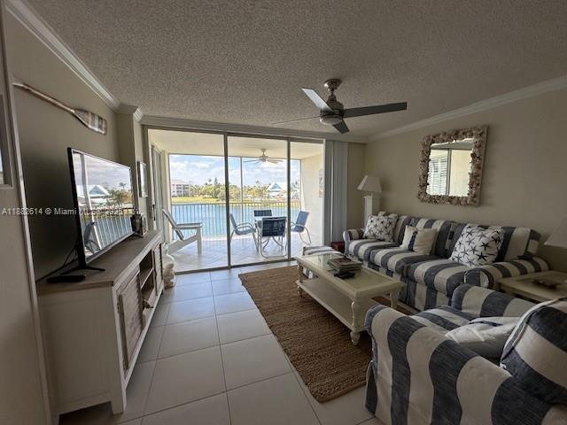 353 Highway 1, Unit C307 Jupiter, FL 33477 - Photo 5 of 12 a living room with furniture a flat screen tv and a large window