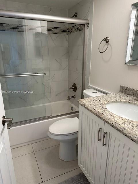 353 Highway 1, Unit C307 Jupiter, FL 33477 - Photo 8 of 12 a bathroom with a granite countertop sink a toilet and shower