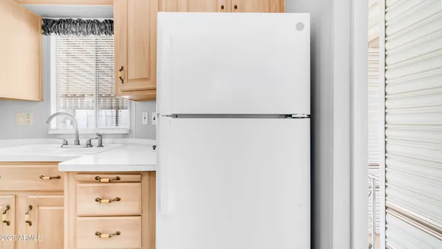a view of a kitchen with a sink