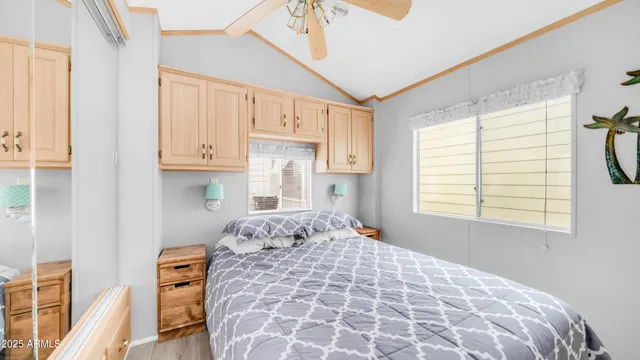 a bedroom with a large bed and a window