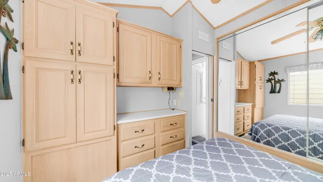 a bedroom with a bed and a cabinets