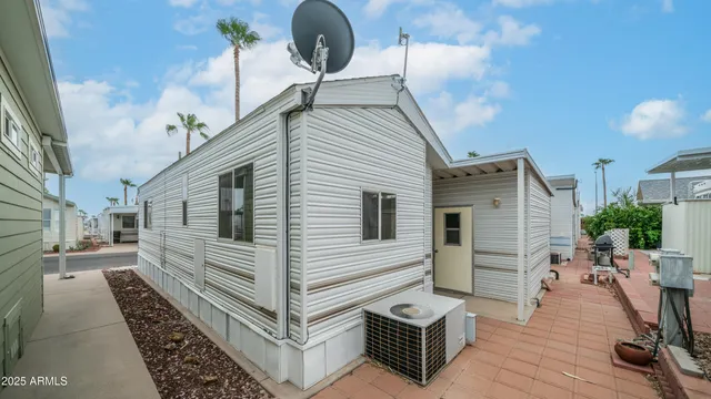 a view of a white house with wooden floor