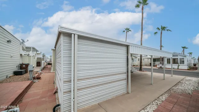 a view of a house with a yard table and chairs