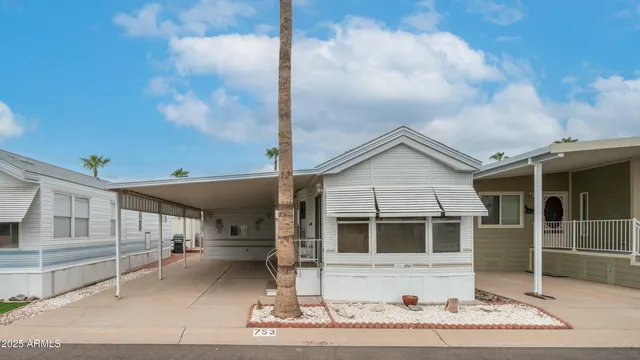 a view of a house with a balcony and wooden door
