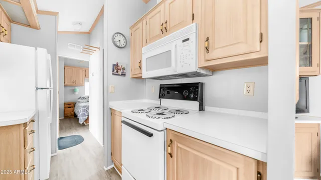 a kitchen with stainless steel appliances granite countertop a stove and a refrigerator