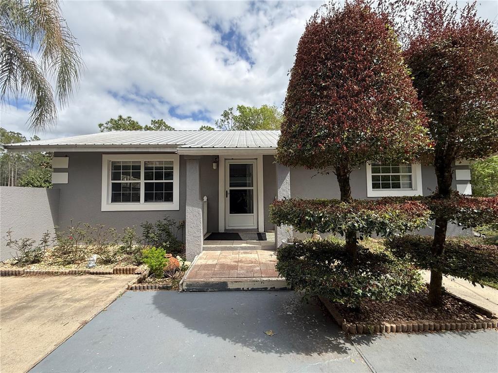 front view of a house with a yard