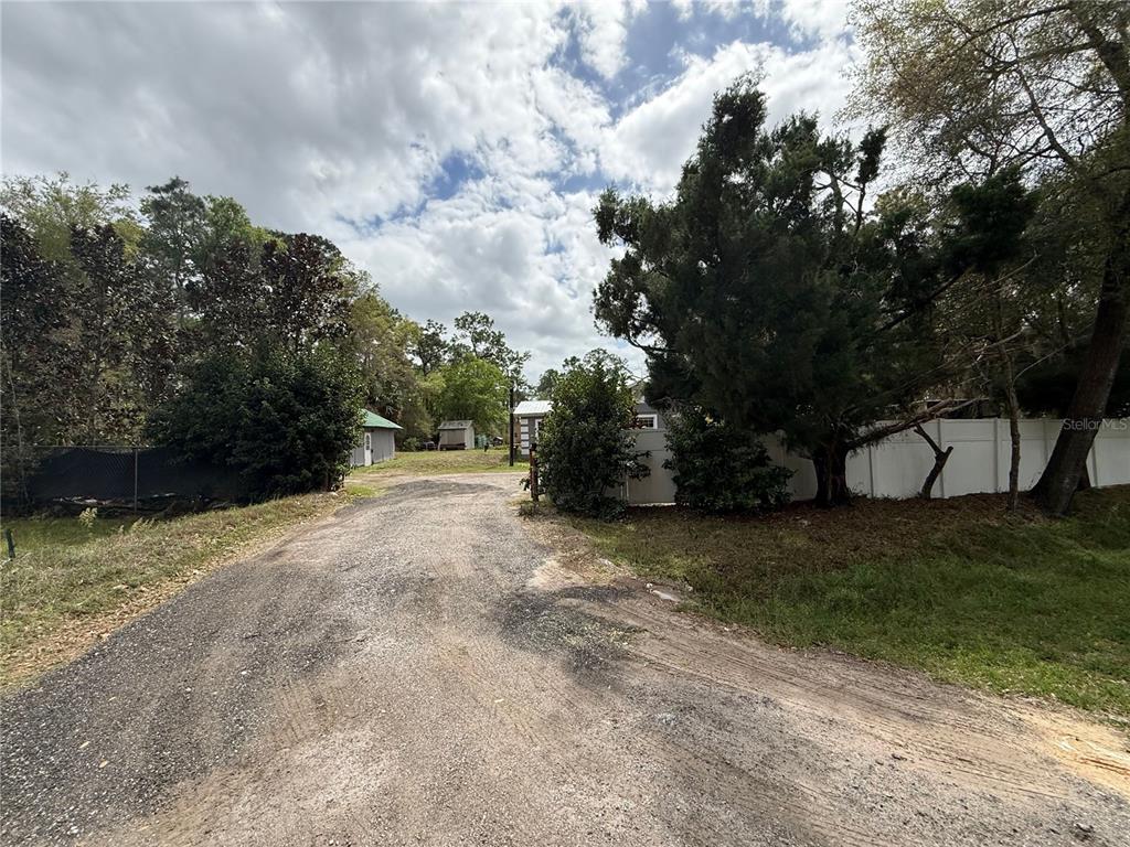 1363 Emporia Road Pierson, FL 32180 - Photo 2 of 27 a view of a field with trees in the background