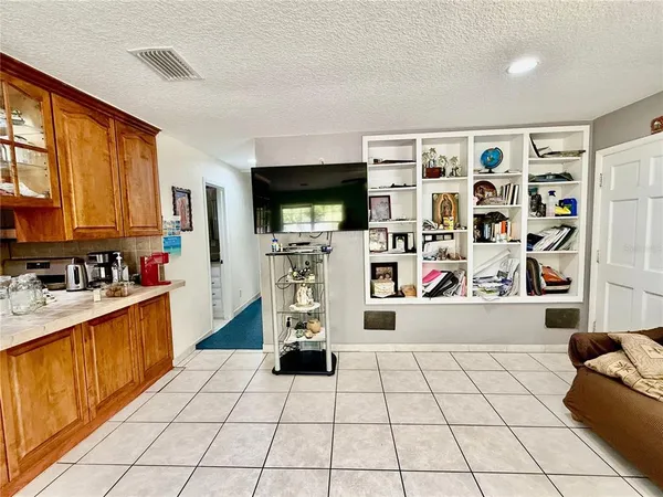 a kitchen with stainless steel appliances a sink and a refrigerator