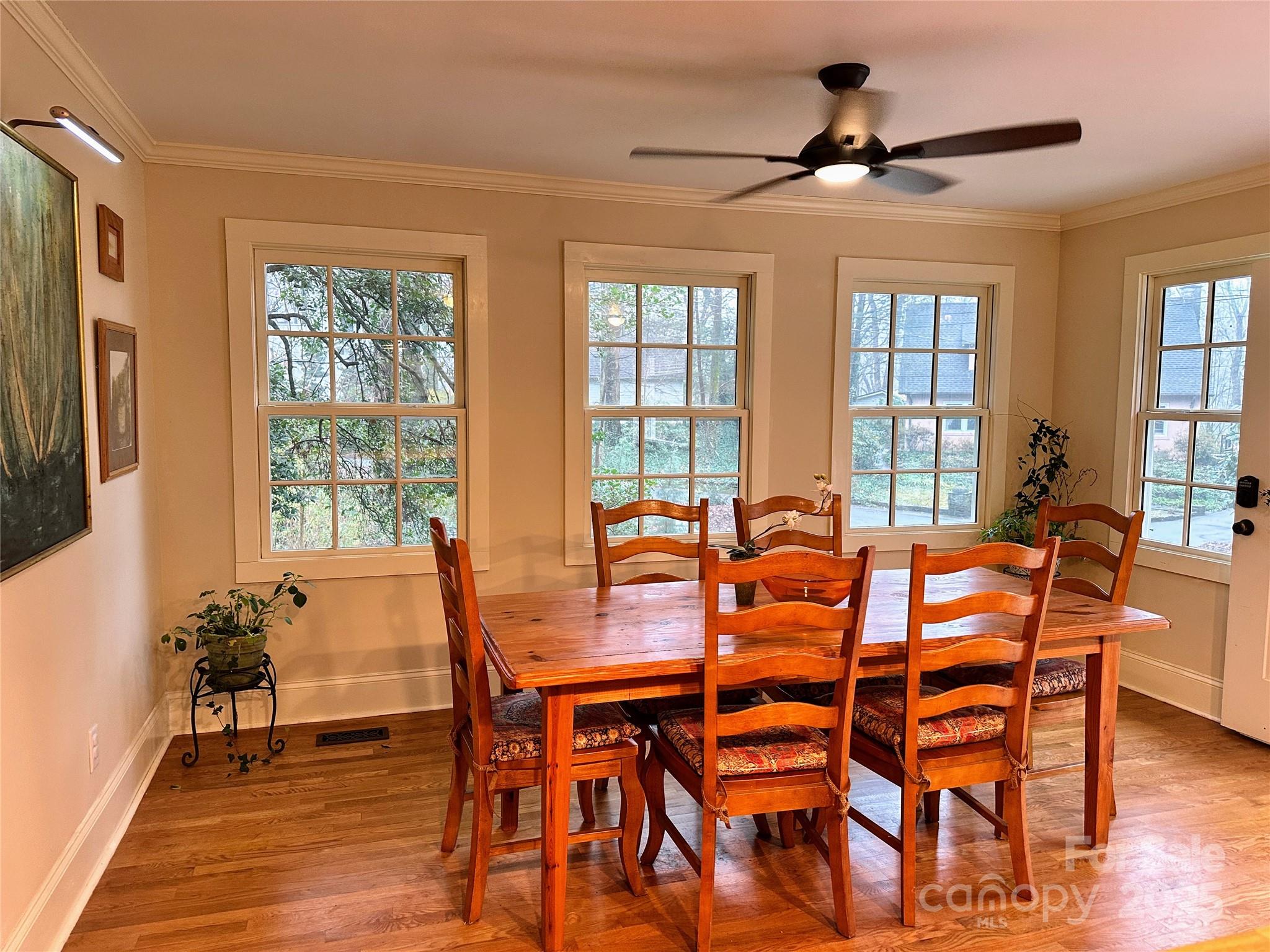 105 Melrose Lane Tryon, NC 28782 - Photo 19 of 35 a view of a dining room with furniture window and wooden floor