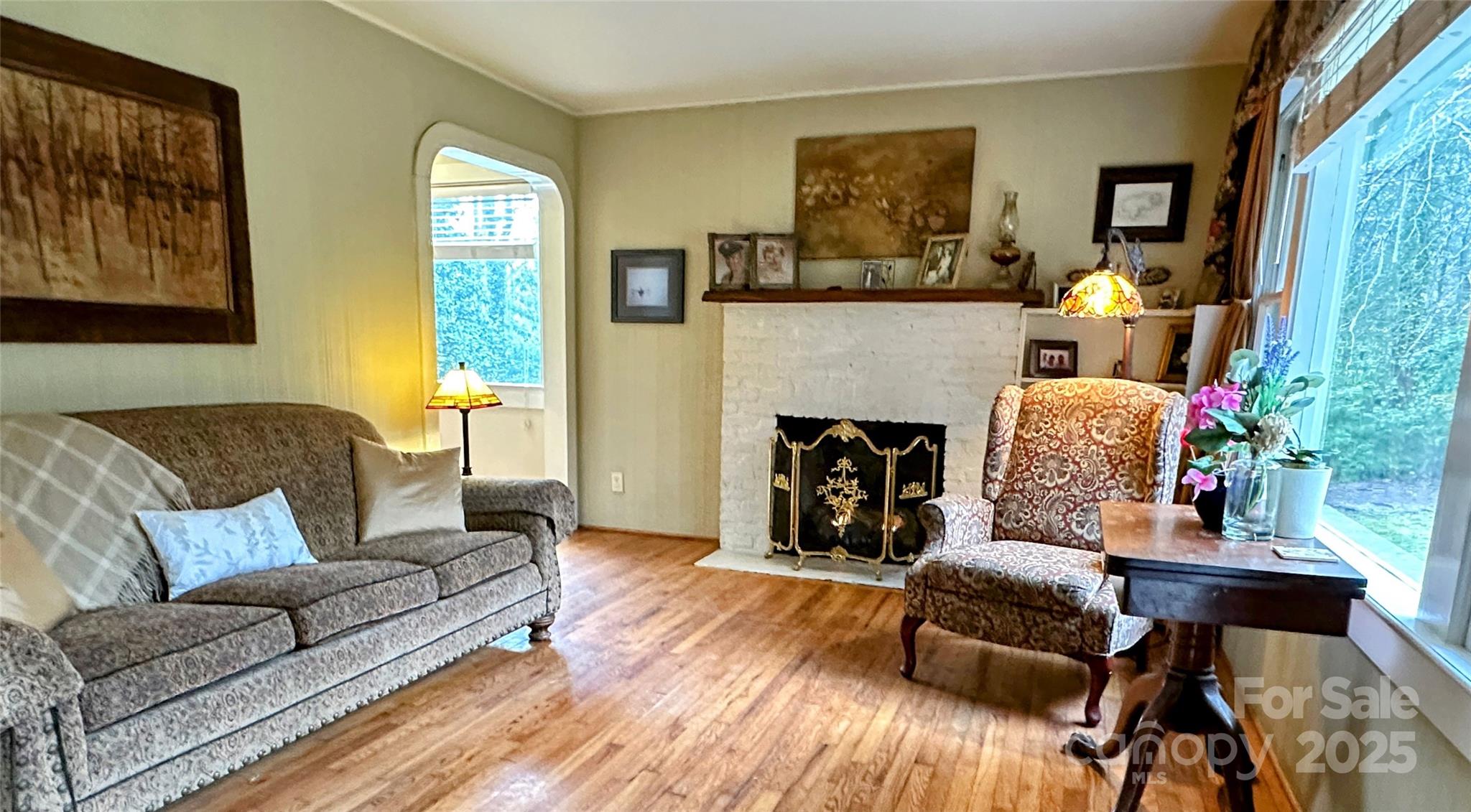 105 Melrose Lane Tryon, NC 28782 - Photo 23 of 35 a living room with furniture and a fireplace