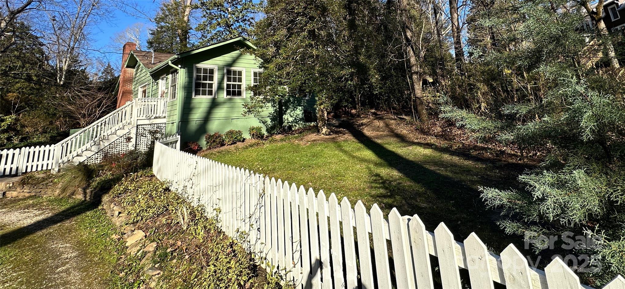 105 Melrose Lane Tryon, NC 28782 - Photo 28 of 35 a view of a house with a yard