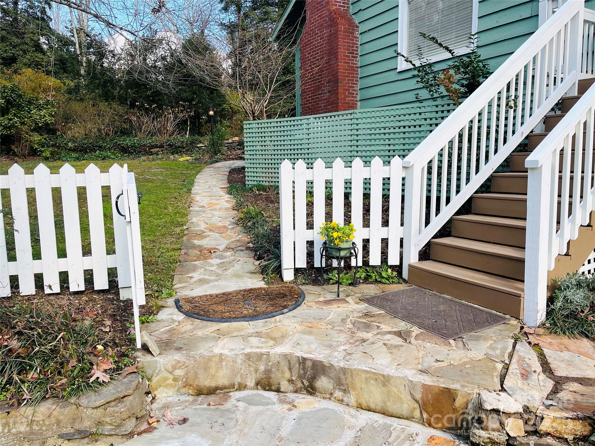 105 Melrose Lane Tryon, NC 28782 - Photo 5 of 35 a view of wooden house with a yard