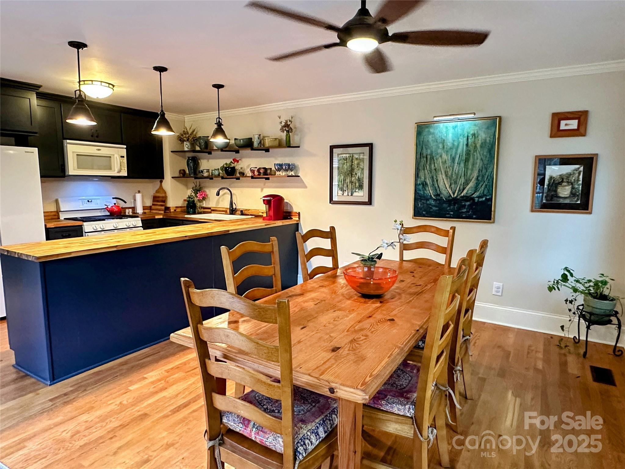 105 Melrose Lane Tryon, NC 28782 - Photo 8 of 35 a dining room with a wooden table and chairs