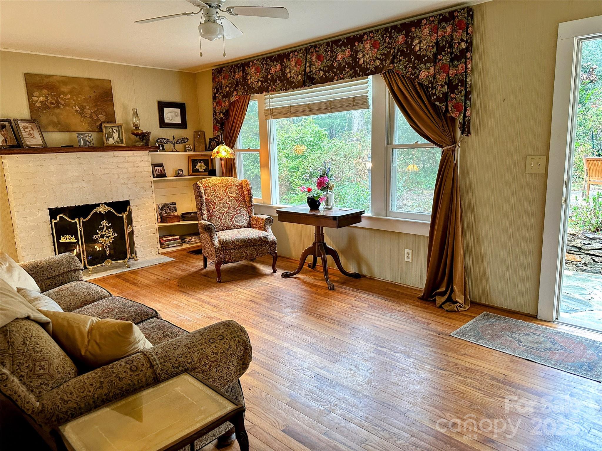 105 Melrose Lane Tryon, NC 28782 - Photo 10 of 35 a living room with furniture and a fireplace
