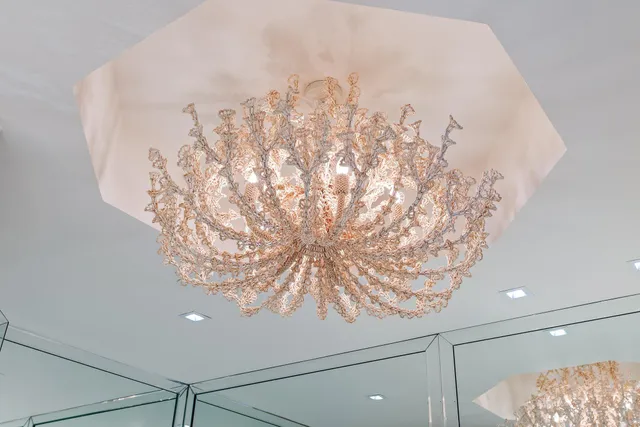 a spacious bedroom with a bed and a dresser