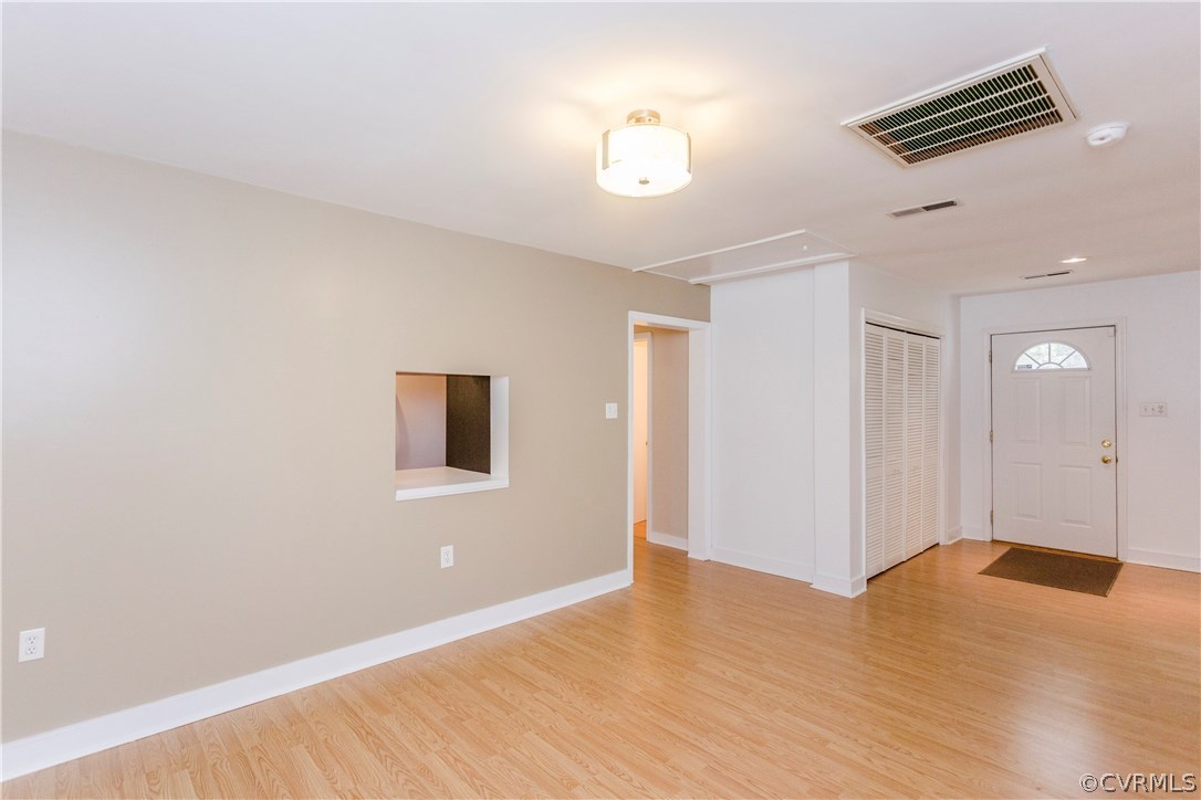 3843 Treely Road Chester, VA 23831 - Photo 33 of 50 a view of a livingroom with wooden floor and a ceiling fan