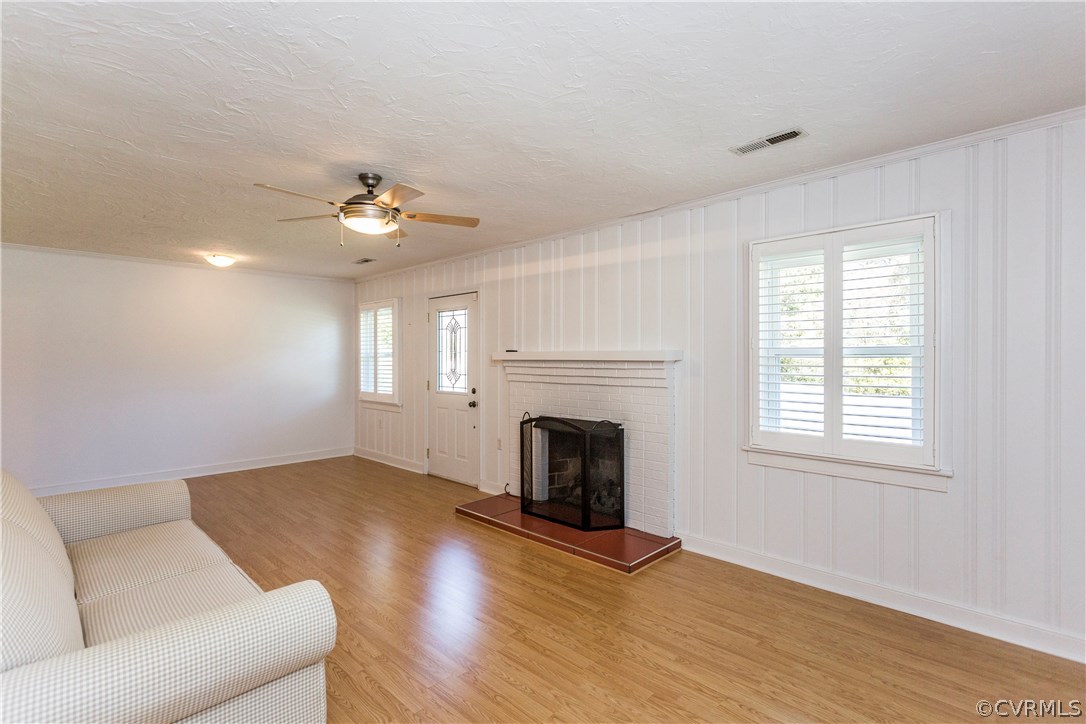 3843 Treely Road Chester, VA 23831 - Photo 8 of 50 a living room with furniture and a fireplace