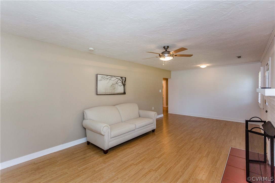 3843 Treely Road Chester, VA 23831 - Photo 9 of 50 a living room with couch and a ceiling fan