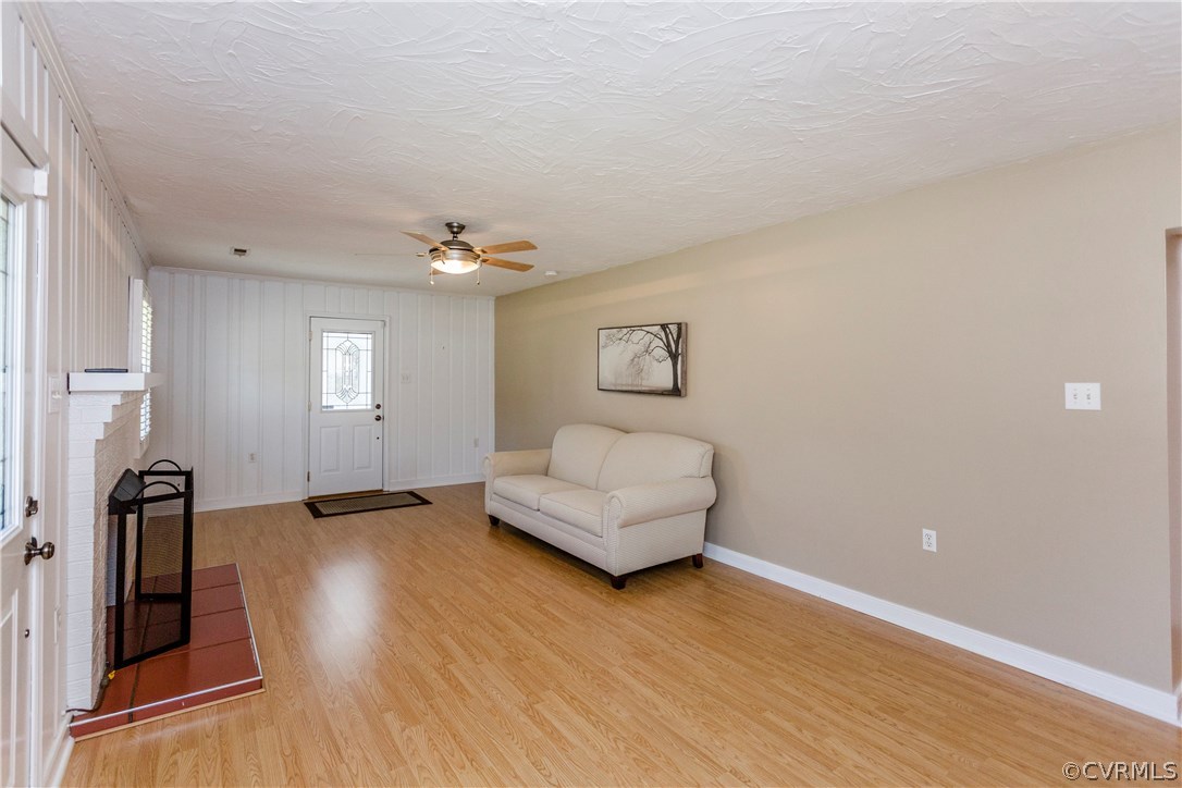 3843 Treely Road Chester, VA 23831 - Photo 10 of 50 a view of an empty room with wooden floor and a window