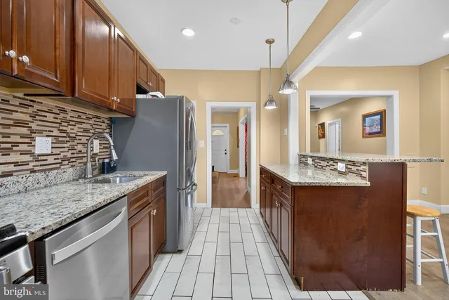 a bathroom with a sink a vanity and a mirror