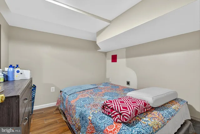 a bed room with a bed and a mirror