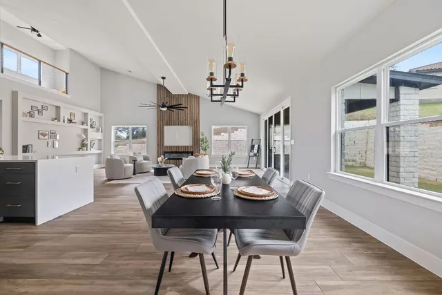 a view of a dining room with furniture window and wooden floor