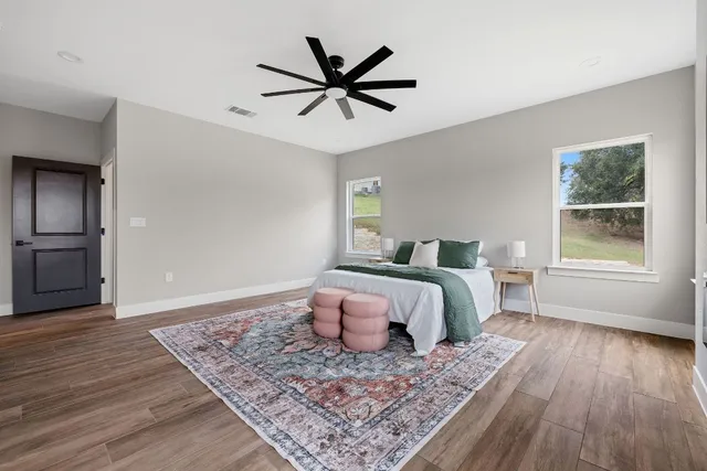 a bedroom with a bed and a window