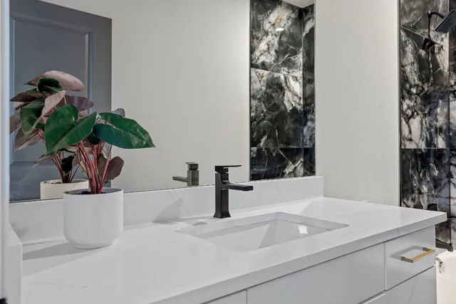 a bathroom with a sink and a mirror