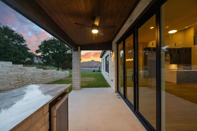 a view of a porch and garden
