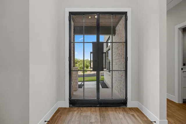 a view of outdoor space with wooden floor and window
