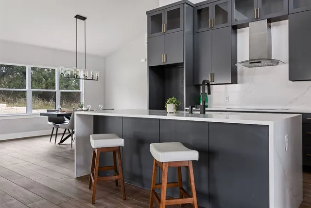 a kitchen with a sink cabinets and window