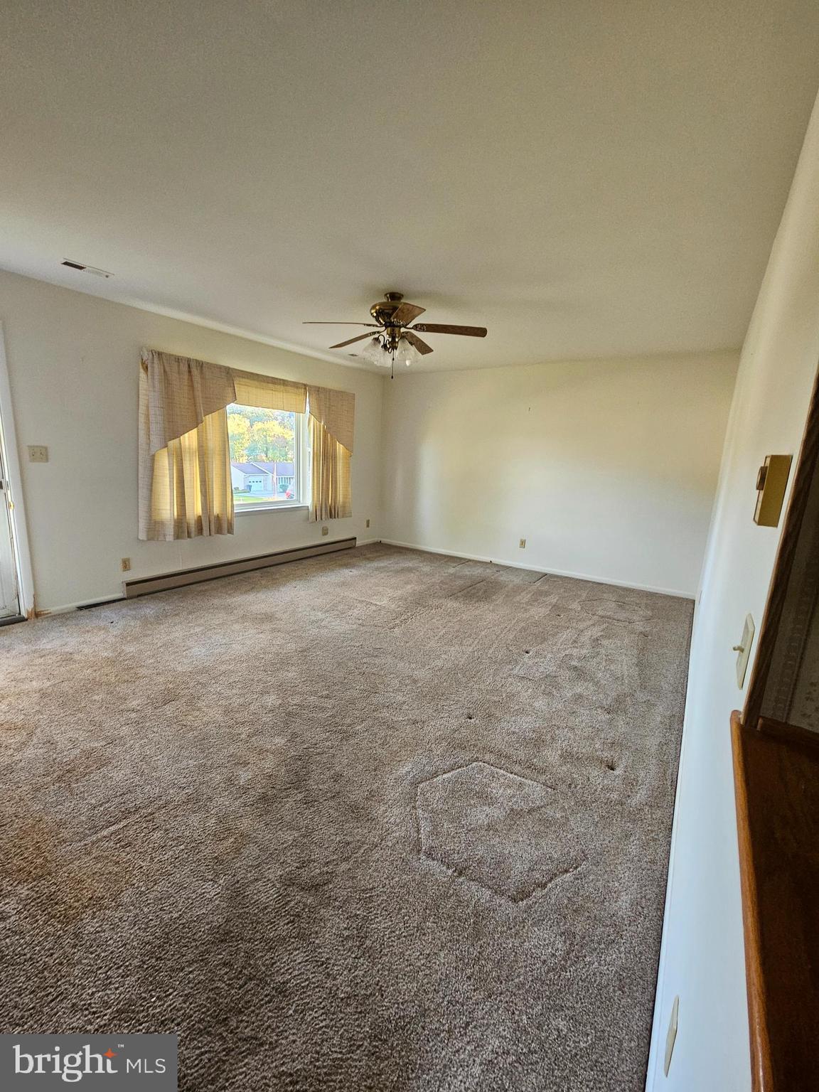 1124 Cedarbrook Road Hampstead, MD 21074 - Photo 8 of 46 Living Room w/Carpeting and Ceiling Fan