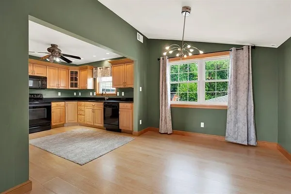 a kitchen with stainless steel appliances granite countertop a stove top oven a sink and a granite counter tops