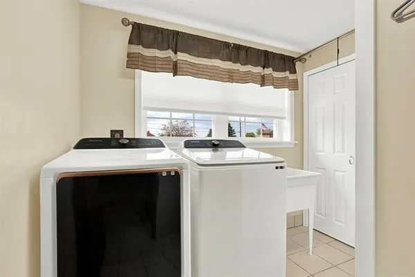 a kitchen with a sink and a refrigerator