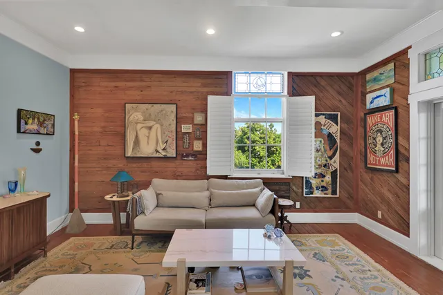 a living room with furniture and a window