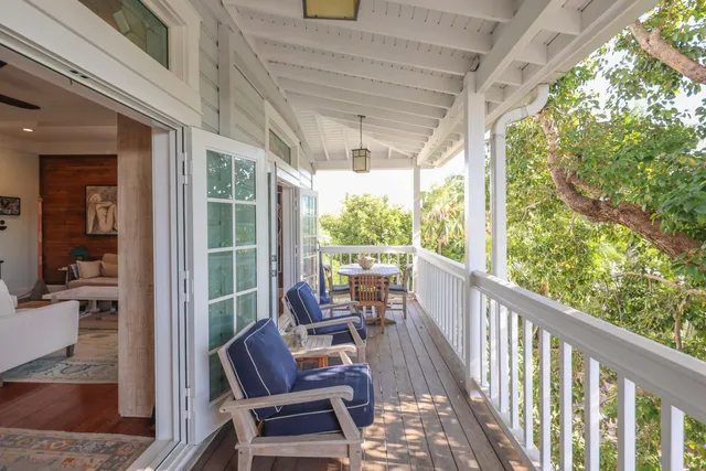 a view of porch with a furniture