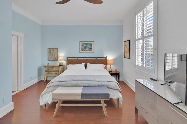 a bedroom with a bed and a table in it