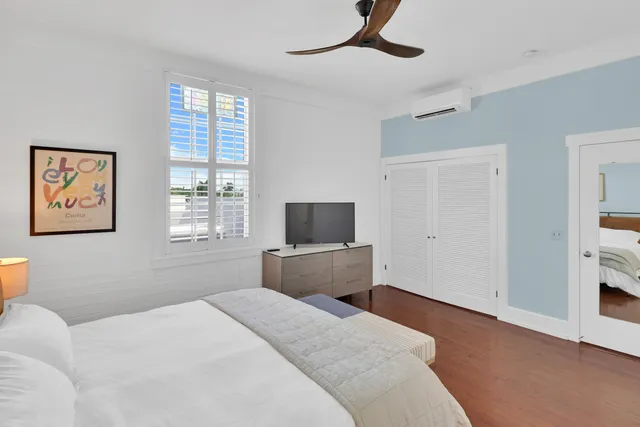 a bedroom with a bed and window